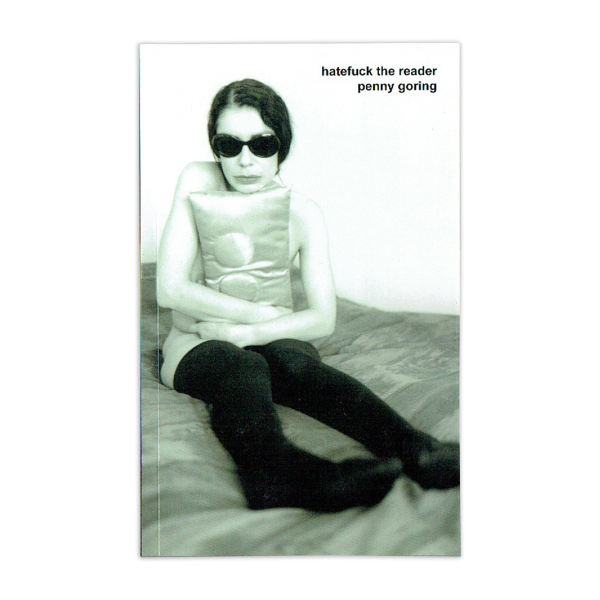 the cover of Penny Goring's 'Hatefuck the Reader': a woman sits on a bed, clutching a silk pillow over her body, wearing stockings and sunglasses